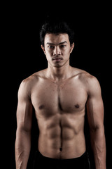 Fototapeta na wymiar Muscular Asian man show his body