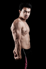 Fototapeta premium Muscular Asian man show his body