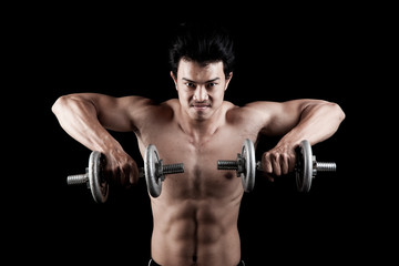 Fototapeta na wymiar Muscular Asian man with dumbbell
