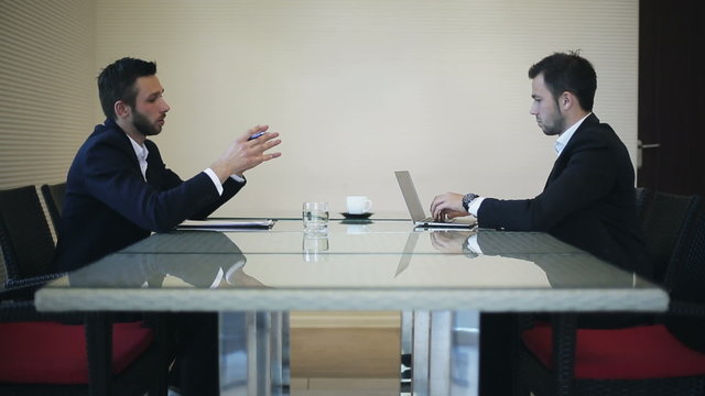 Business people working in office with a laptop
