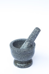 Stone mortar and pestle on white background