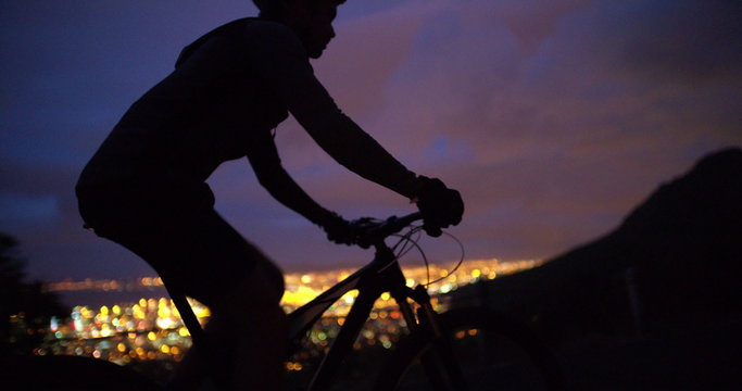 Low angle cropped shot of unrecognizable cyclist riding his bicycle