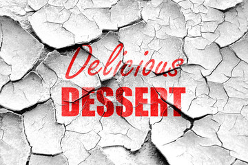 Grunge cracked Delicious dessert sign