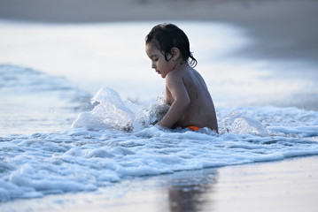 kid play in beach