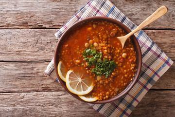 Thick Moroccan soup in a bowl on the table. horizontal view from above
