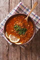 Thick Moroccan soup in a bowl on the table. vertical view from above
