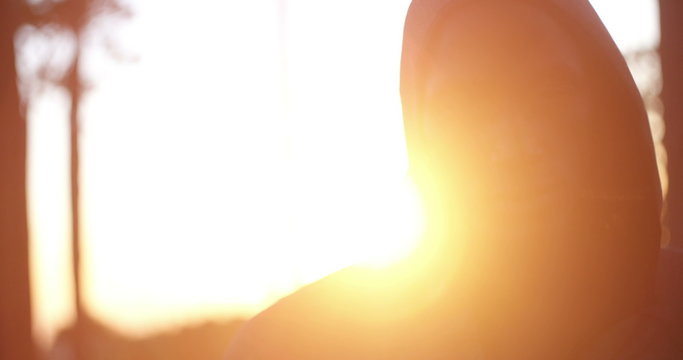 Close up shot with lens flare of determined african-american athlete 