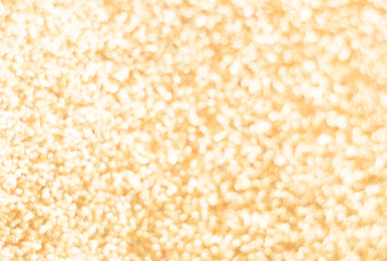 Abstract blur gold bokeh light background.