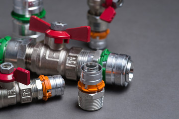 Water valves with fittings on grey