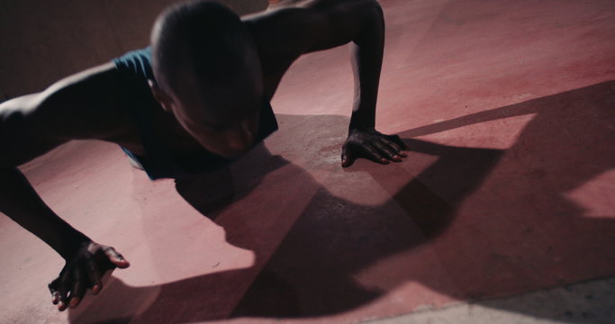 Close up shot of Afro-american busy doing pushups 