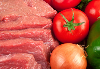 fresh raw beef with vegetables closeup