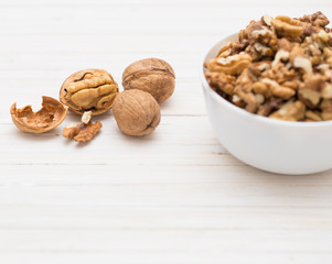 walnuts on white wooden background