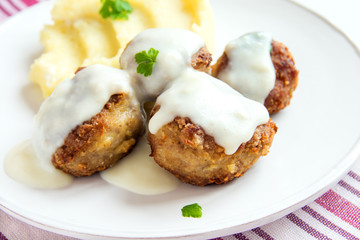 Meatballs with white creamy sauce