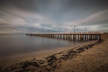 Obraz premium Gdynia Orlowo pier. Vintage photo of Baltic sea shore seascape.