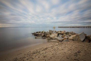 Gdynia Orlowo pier. Vintage photo of Baltic sea shore seascape.
