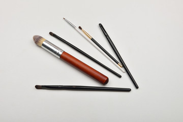 Picture of professional makeup brushes on white background