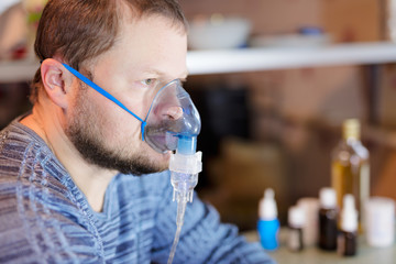 Man sitting with nebulizer