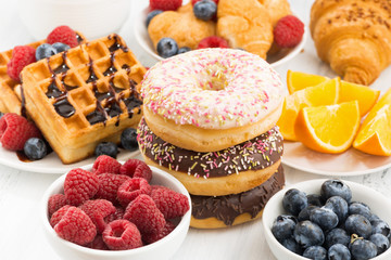 glazed donuts, sweets and fresh berries
