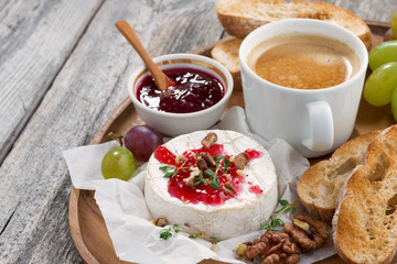 gourmet breakfast- camembert with berry jam, toast, coffee
