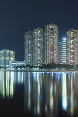 Fototapeta na wymiar Residential buildings in Hong Kong city at night