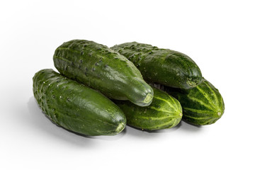 Cucumber and slices isolated over white background