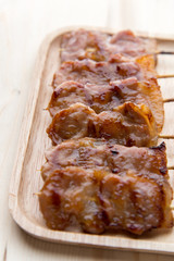 grilling pork with stick