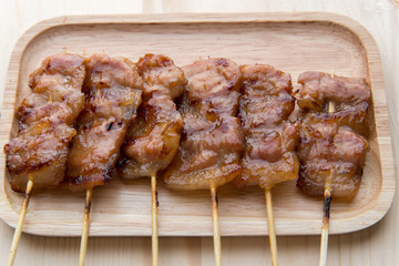 grilling pork with stick