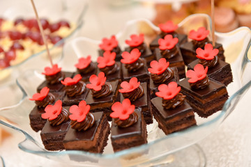 Chocolate cakes with red flower placed in a glass dish