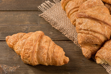 Breakfast croissant on a rustic background