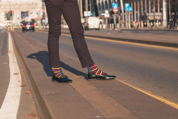 Fototapeta premium Detail of an Indian handsome man posing in an urban context