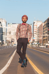 Indian handsome man posing in an urban context