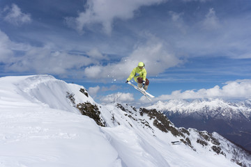 Naklejka na ściany i meble Ski jump on mountains. Extreme winter sport.