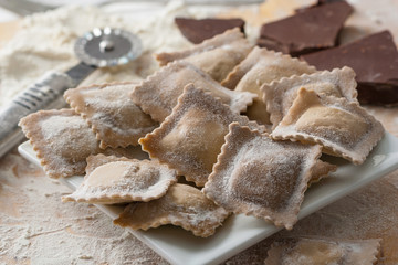 Fototapeta na wymiar Homemade Italian ravioli stuffed with sweet chocolate.
