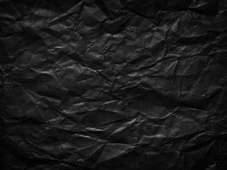 Black crumpled paper as a background