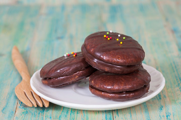 chocolate Sponge sandwich pie on wood table