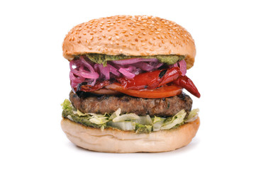 Big tasty hamburger burger with pesto isolated on white