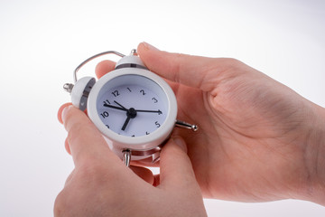 Alarm clock in hand