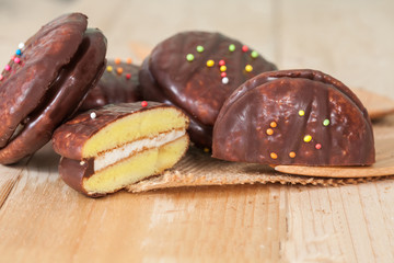 chocolate Sponge sandwich pie on wood table