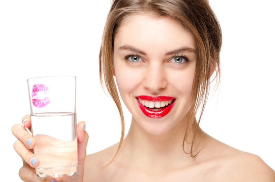 Beautiful Girl Holds a Glass of Pure Water smiling