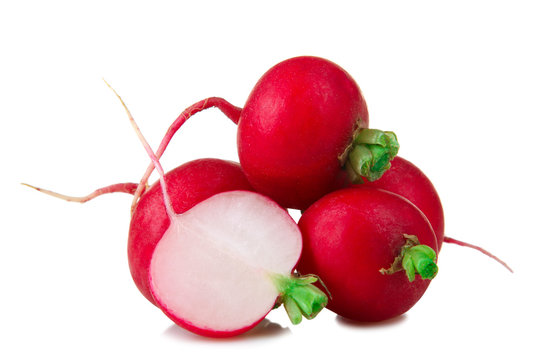 chopped red radishes bunch green tail on a white background isolated
