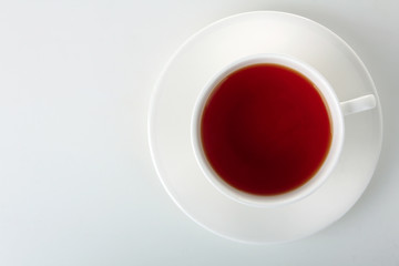 Cup with fresh green tea on white isolated background