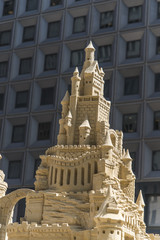 Sandcastle modeling on new building background