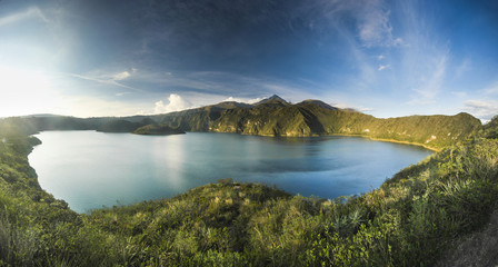 Obraz premium panorama of crater lake with two islands at sunset