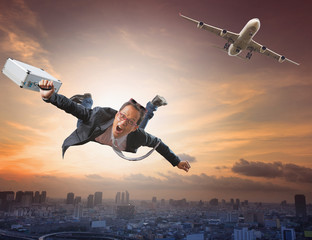 crazy business man flying from passenger plane with glad and hap