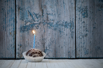 birthday cupcake on wooden background