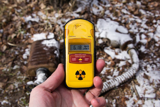 UKRAINE. Chernobyl Exclusion Zone. - 2016.03.19. Dosimeter on the background of snow-covered mask