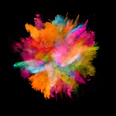 Explosion of colored powder on black background