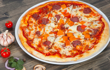 pizza with mushrooms, salami, vegetables
