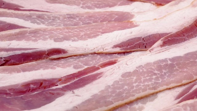 Raw Bacon Strips Rotating