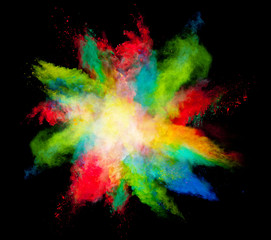 Explosion of colored powder on black background